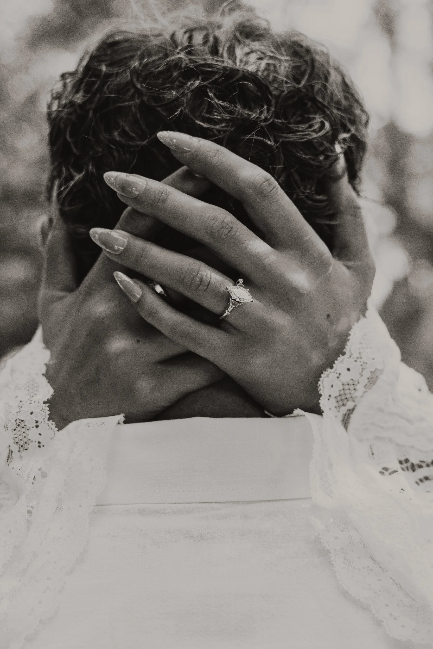 Hope's hands in Kelly's hair, engagement ring visible
